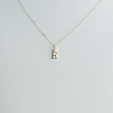 Necklace with a small pendant on a light gray background