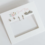 Set of earrings on a branded card with 'Sweet Thess' branding.